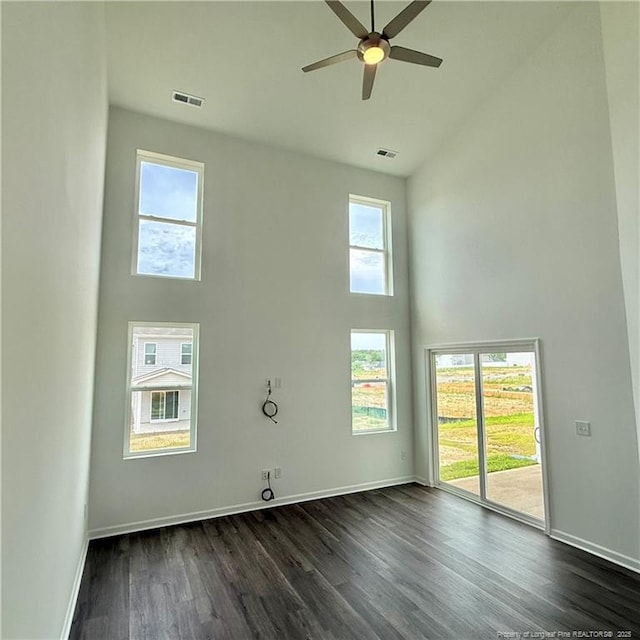 659 Union St, Home, Raeford, NC 28376 - unfurnished room featuring high vaulted ceiling, plenty of natural light, ceiling fan, and dark wood-type flooring