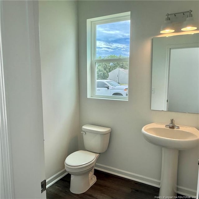 659 Union St, Home, Raeford, NC 28376 - bathroom featuring toilet and wood finished floors