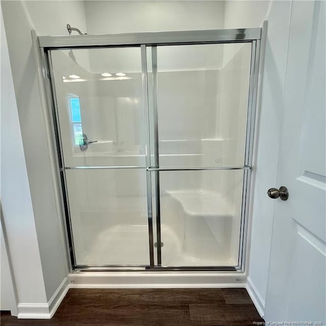 659 Union St, Home, Raeford, NC 28376 - bathroom featuring a shower stall and wood finished floors