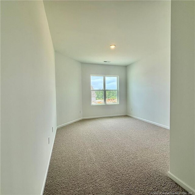 659 Union St, Home, Raeford, NC 28376 - carpeted spare room with baseboards and recessed lighting