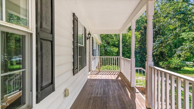 wooden deck featuring covered porch