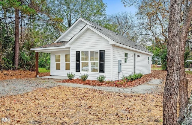 view of front of house with a shingled roof