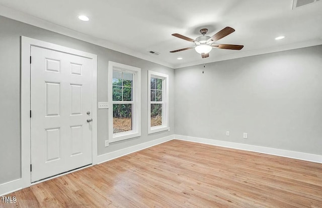 foyer with light wood-style flooring, recessed lighting, visible vents, baseboards, and ornamental molding