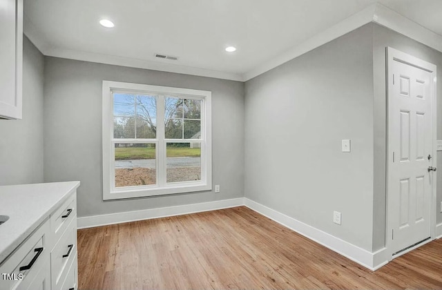 interior space with recessed lighting, visible vents, light wood-style flooring, and baseboards