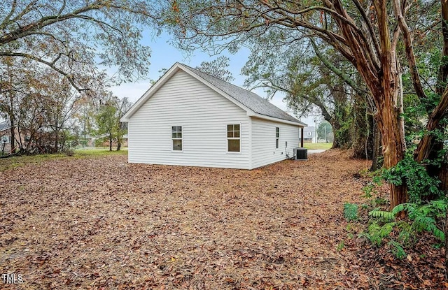 view of side of property with central AC