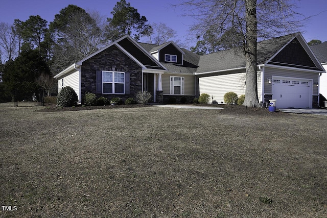 view of front facade with a garage, stone siding, and a front lawn