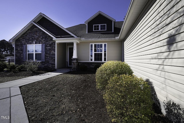 view of exterior entry with stone siding