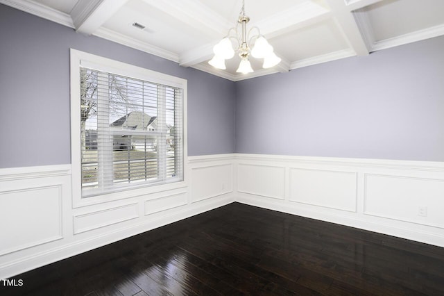 unfurnished room with dark wood-style floors, beam ceiling, a notable chandelier, visible vents, and wainscoting