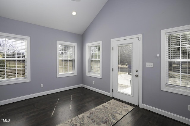 doorway featuring recessed lighting, dark wood-style flooring, vaulted ceiling, and baseboards