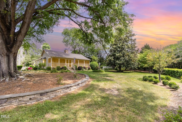 yard at dusk with a porch