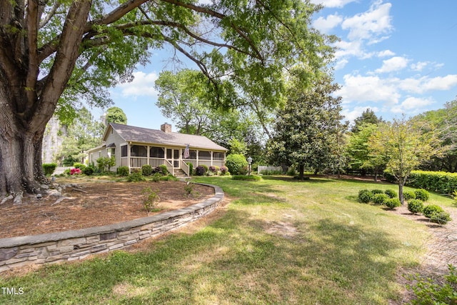 view of yard featuring a sunroom