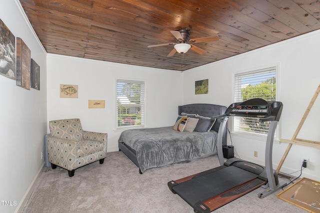 carpeted bedroom featuring wood ceiling, multiple windows, and baseboards