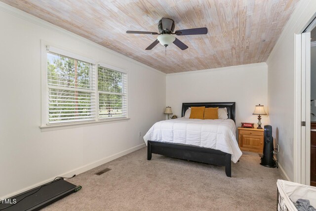 bedroom with carpet, crown molding, visible vents, wooden ceiling, and baseboards