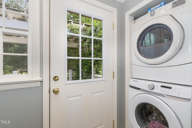 laundry room featuring laundry area and stacked washing maching and dryer