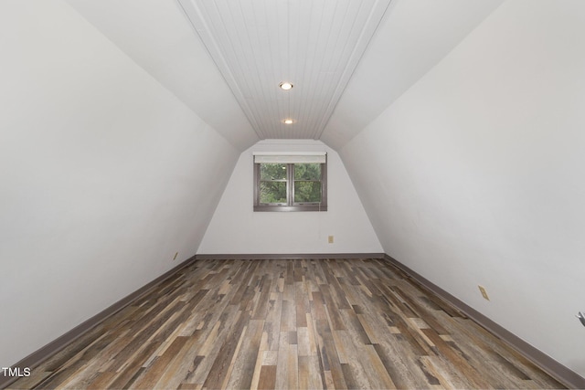 bonus room with lofted ceiling, recessed lighting, wood finished floors, and baseboards