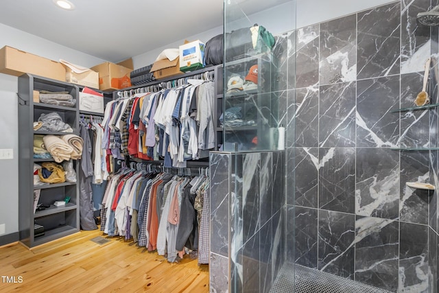 spacious closet featuring wood finished floors