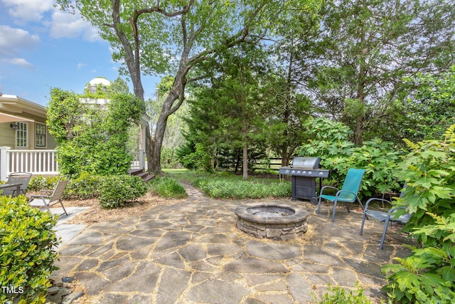 view of patio featuring a grill and a fire pit