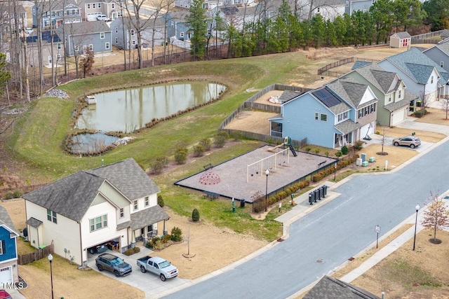 aerial view with a water view and a residential view