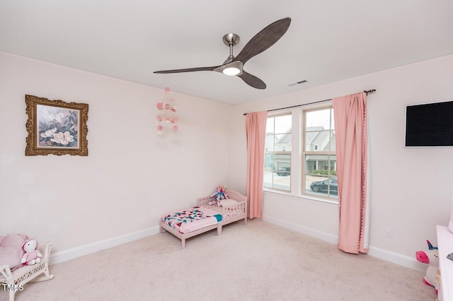 rec room featuring visible vents, ceiling fan, light carpet, and baseboards