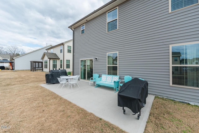 back of property with a patio and a lawn