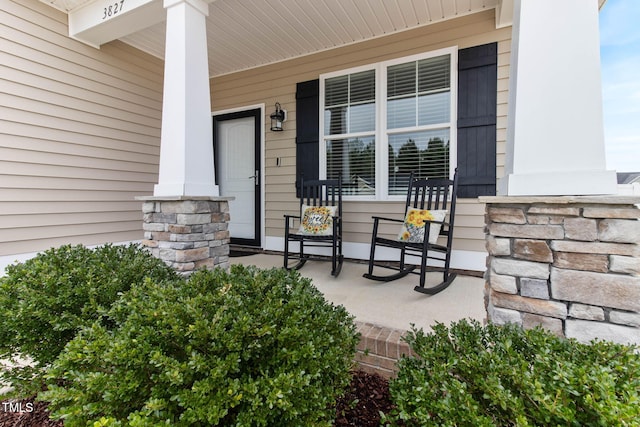 property entrance with covered porch