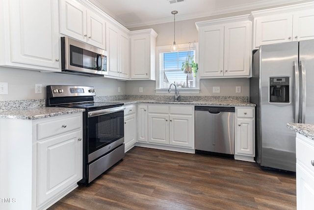 kitchen with stainless steel appliances, dark wood-type flooring, a sink, and white cabinets