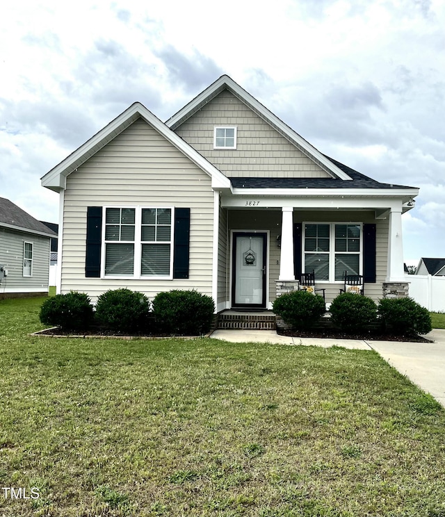 3827 Bucklin Dr NE, Elm City, NC 27822 - view of front of house with a front lawn and a porch