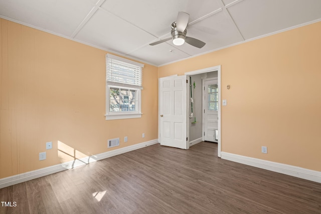 unfurnished bedroom with visible vents, baseboards, and wood finished floors