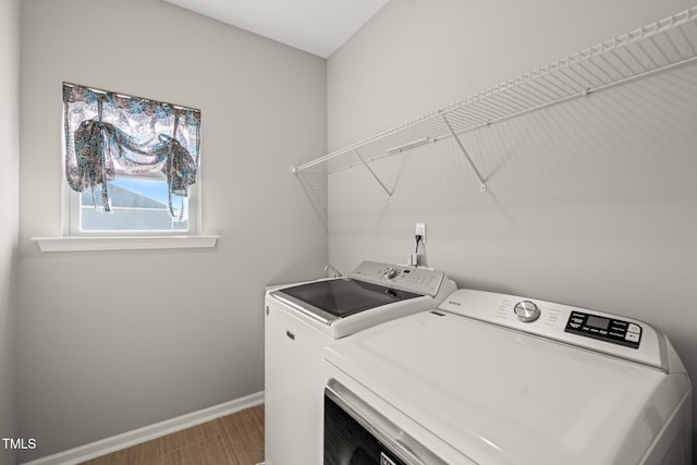 3356 Longleaf Estates Dr, Raleigh, NC 27616 - washroom featuring baseboards, separate washer and dryer, wood finished floors, and laundry area