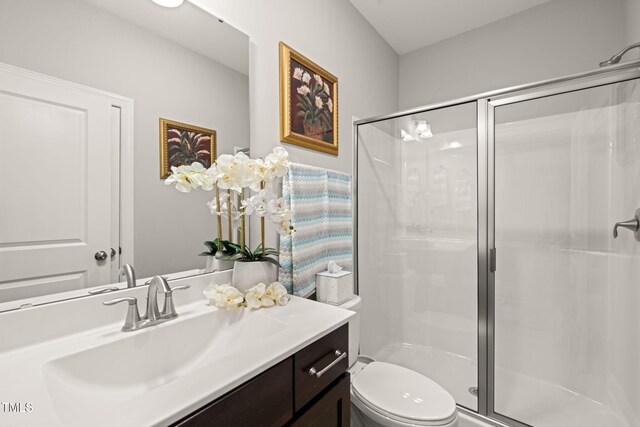 3356 Longleaf Estates Dr, Raleigh, NC 27616 - full bathroom with vanity, toilet, and a shower stall