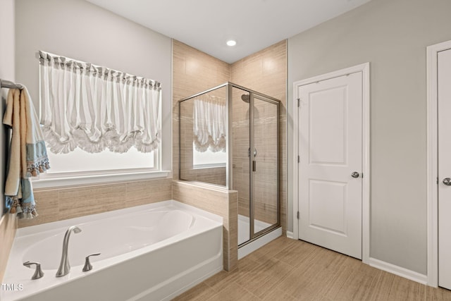 3356 Longleaf Estates Dr, Raleigh, NC 27616 - full bath with a bath, a shower stall, and baseboards