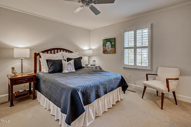 bedroom featuring light carpet, baseboards, and crown molding