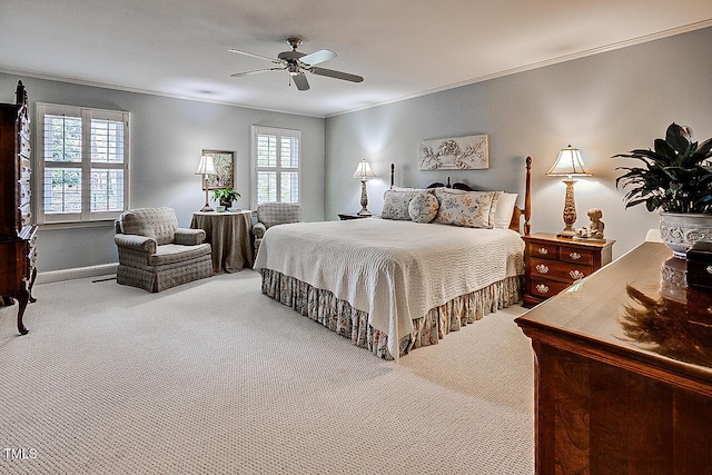 bedroom featuring ceiling fan, carpet floors, and crown molding