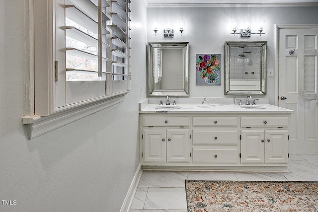 bathroom featuring double vanity, marble finish floor, baseboards, and a sink