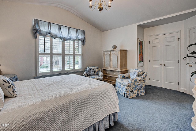 bedroom with lofted ceiling, dark carpet, and a notable chandelier