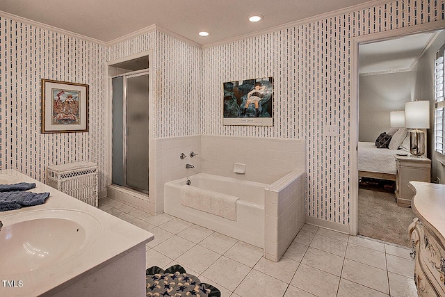 ensuite bathroom with wallpapered walls, a stall shower, crown molding, and vanity