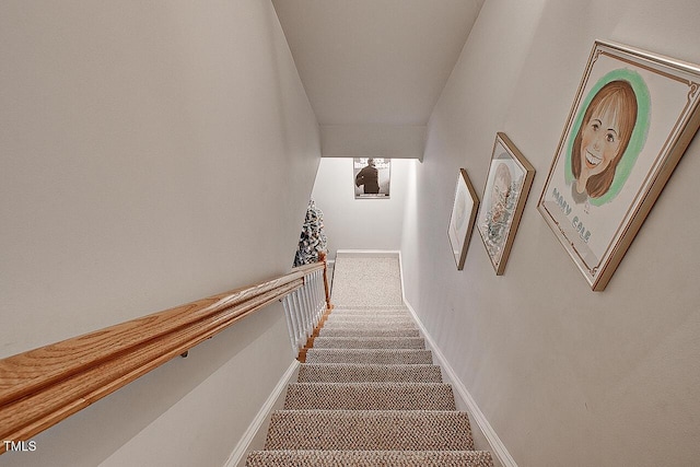 staircase with carpet and baseboards