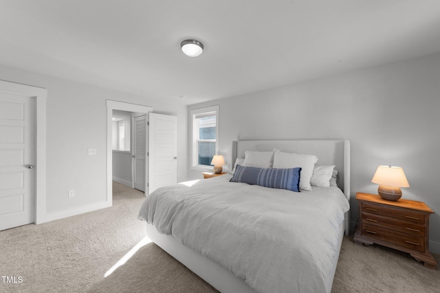 bedroom with carpet flooring and baseboards