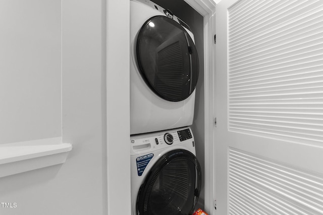 laundry area with laundry area and stacked washer and clothes dryer