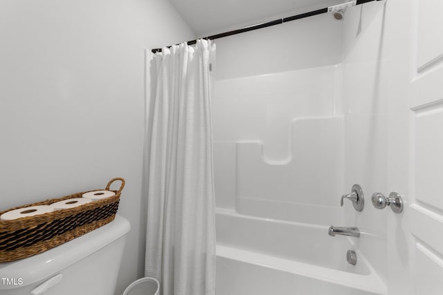 bathroom featuring shower / bath combination with curtain and toilet