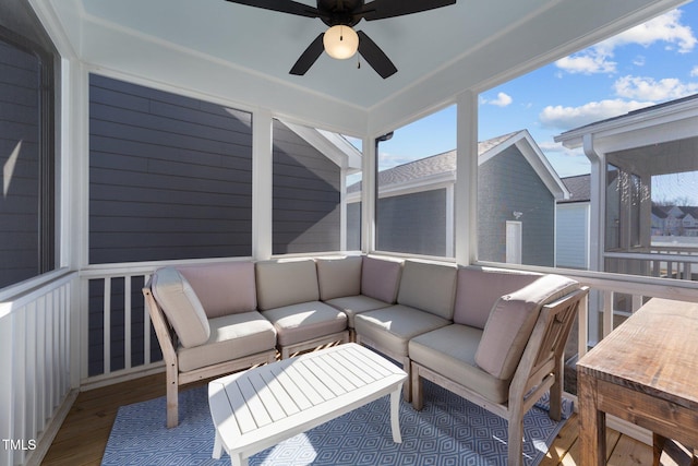 sunroom / solarium featuring ceiling fan