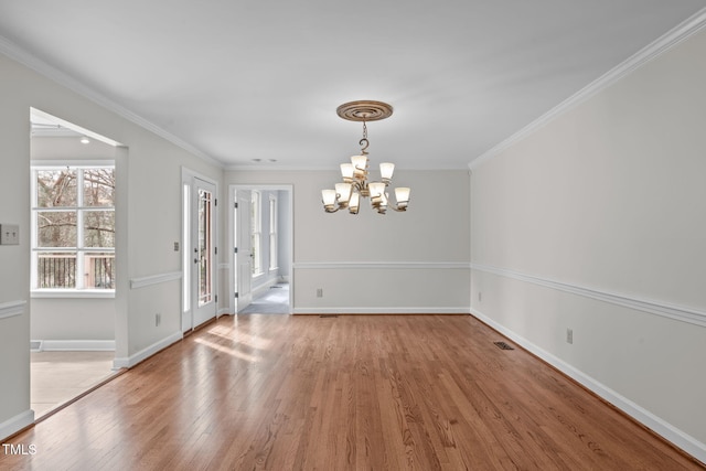 unfurnished dining area with a notable chandelier, baseboards, crown molding, and light wood-style floors