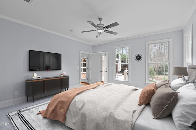 bedroom with a ceiling fan, crown molding, light colored carpet, and baseboards