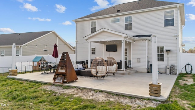 rear view of property with a patio area, fence, an outdoor living space, and roof with shingles