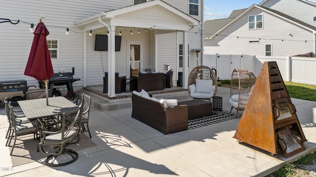 view of patio with fence, outdoor lounge area, and outdoor dining space