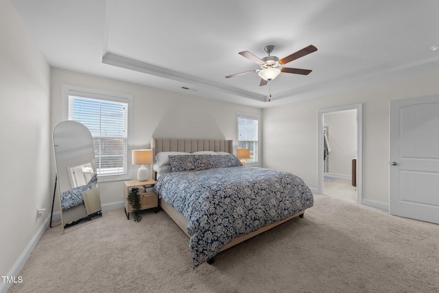 bedroom featuring ceiling fan, light carpet, visible vents, baseboards, and a raised ceiling