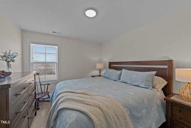 carpeted bedroom with visible vents