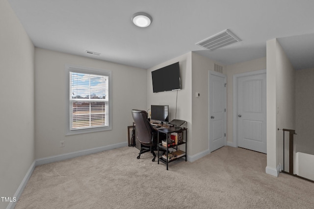 office area with carpet floors, visible vents, and baseboards