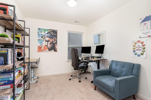 home office with carpet flooring, baseboards, and visible vents