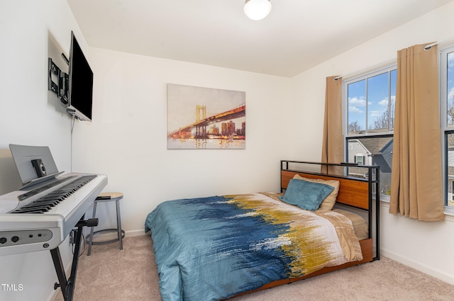 carpeted bedroom with baseboards